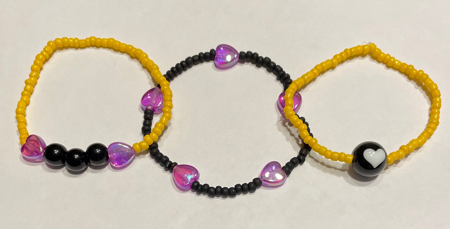 Yellow, black & purple bracelets