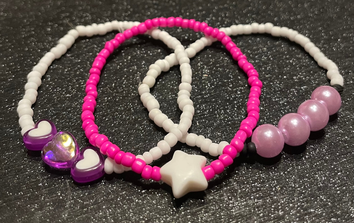 Pink and white bracelets